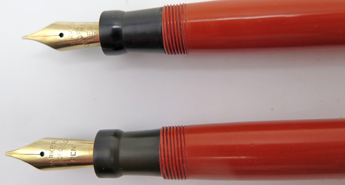 COMES WITH TWO PARKER DUOFOLD SENIOR FLAT TOP FOUNTAIN PENS. ORANGE WITH BLACK TAPOR. BUTTON FILLERS